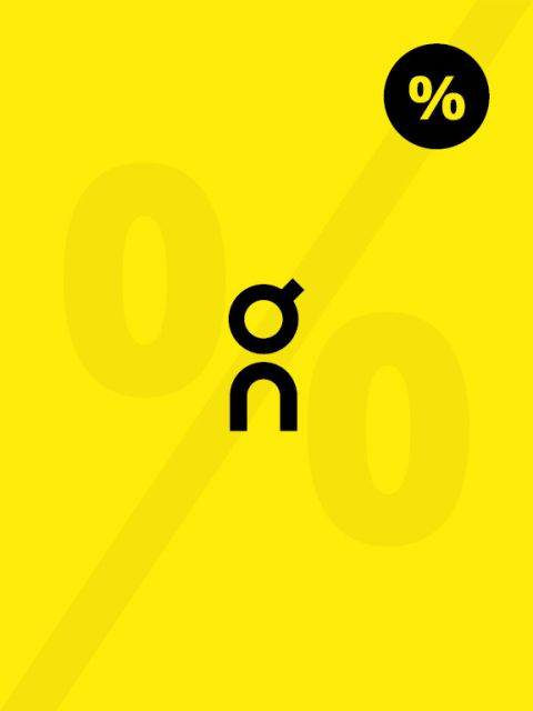 Fondo amarillo con una línea diagonal, grandes símbolos desvanecidos de "0 %" y un símbolo negro más pequeño que consta de las letras "o" y "n". Un círculo negro con un "%" blanco en la esquina superior derecha.