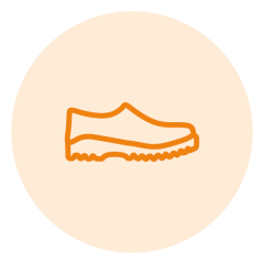 Dibujo lineal naranja de un zapato sobre un fondo circular de color beige claro. El zapato tiene un diseño simple con una suela ondulada, típica de calzado casual o deportivo.