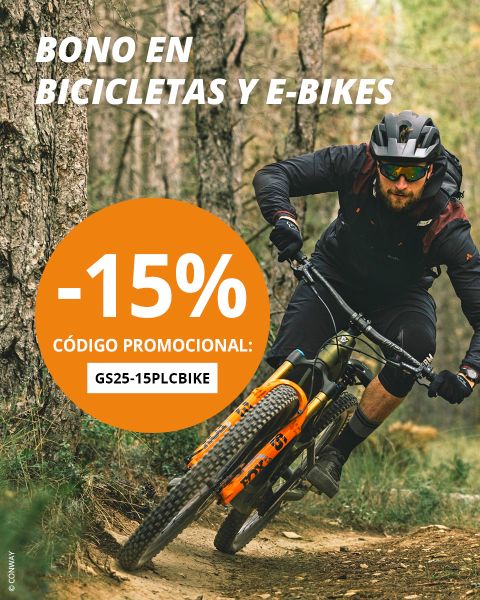 Un hombre con gafas de sol y casco monta en bicicleta de montaña por un bosque. Un círculo naranja en el lado izquierdo anuncia "-15% CÓDIGO PROMOCIONAL: GS25-15PLCBIKE" para bicicletas y bicicletas eléctricas.