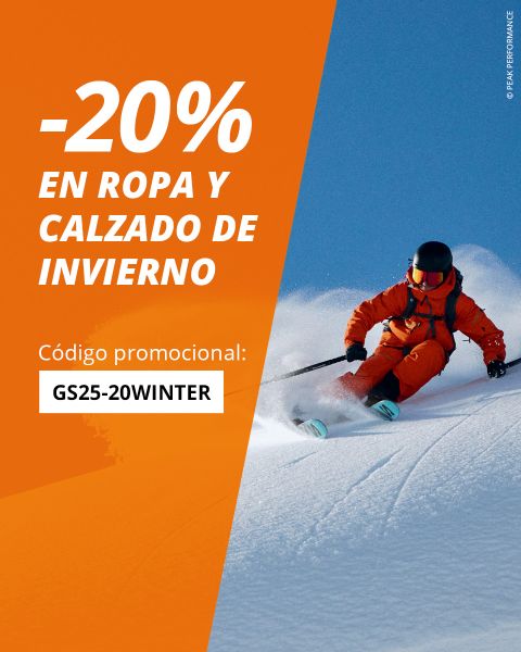 Un hombre baja una ladera nevada con ropa de invierno naranja. El texto en español ofrece un 20% de descuento en ropa y calzado de invierno con el código promocional GS25-20WINTER. Fondo naranja y azul.