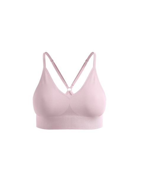 Bralette rosa claro sin costuras con tirantes ajustables cruzados en la espalda sobre un fondo blanco.