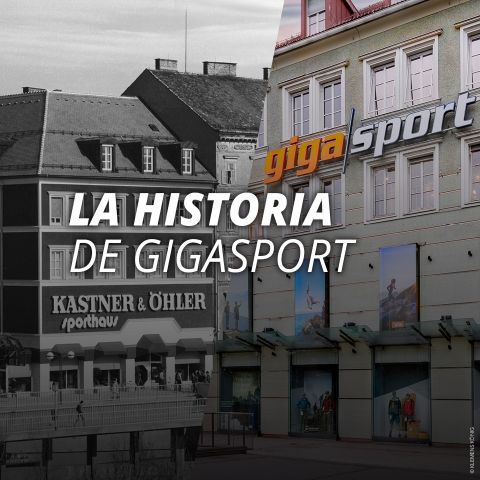 Vista a la calle de un edificio con el letrero "Gigasport", grandes ventanales y la superposición de texto "LA HISTORIA DE GIGASPORT" en español.